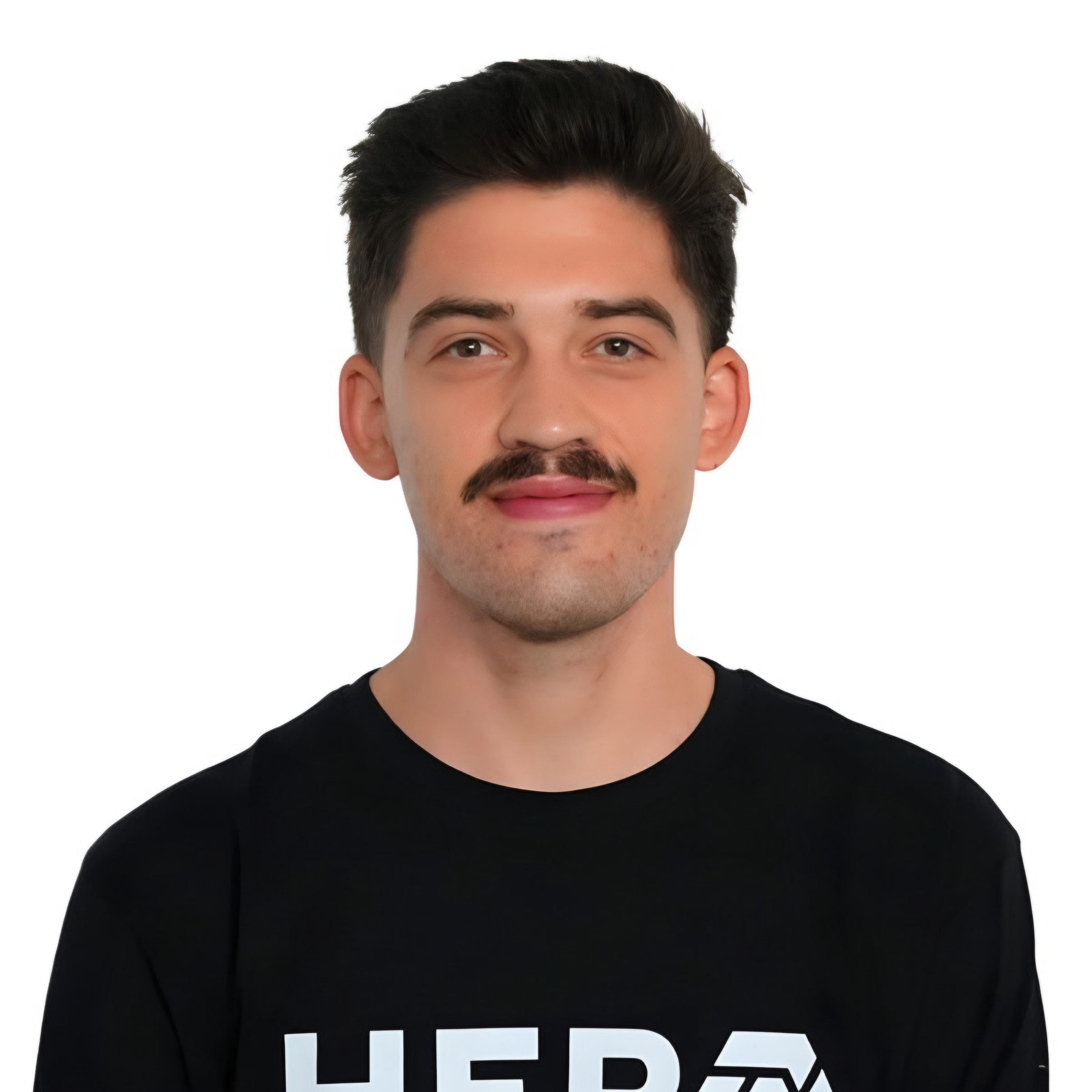 Portrait of Erik in a black HERO shirt against a white background